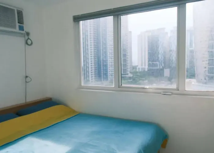 5-mins Sm Aura Cozy 2br Free Parking Apartment